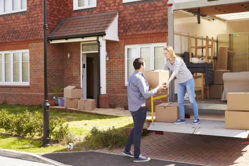 Moving boxes and furniture in an Eastbarnet flat removal